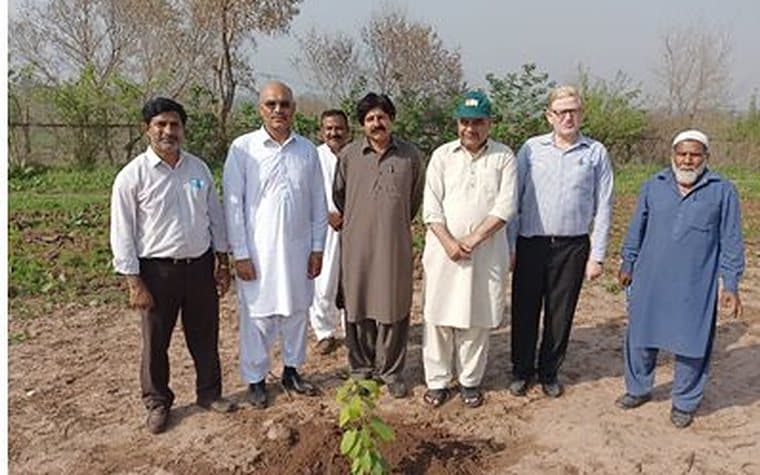 Officials inspecting a field planting at NIGAB